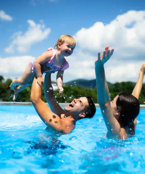 young-family-in-pool-with-daughter